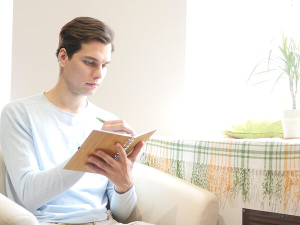 Bigstock Man Writing Notes With Elegant 201054166