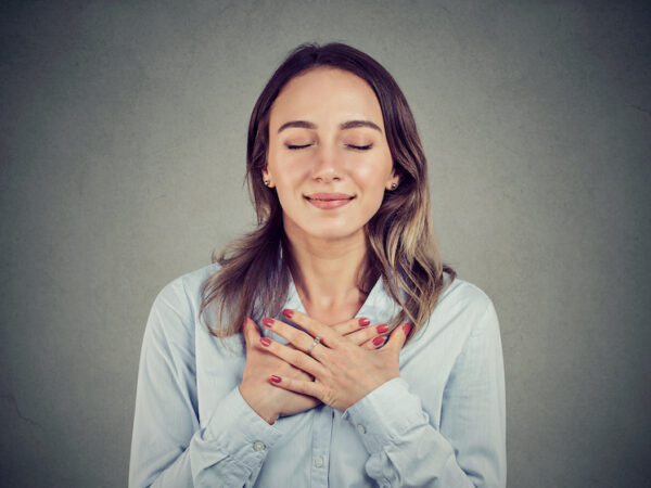 Bigstock Woman With Eyes Closed Keeps H 247507675