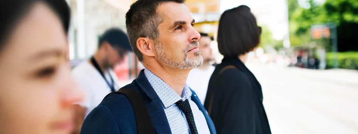 Man Standing At Bus Stop
